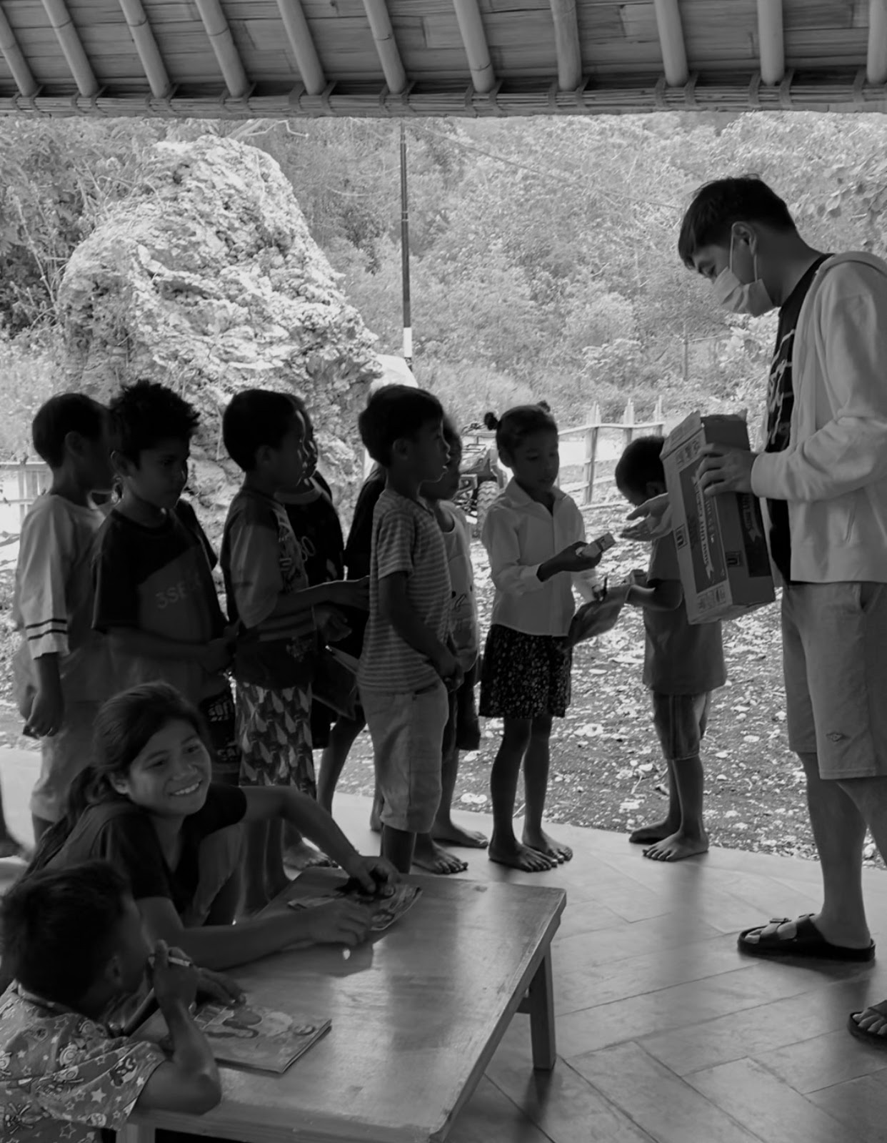 Children receiving their daily glass of milk at the learning center
